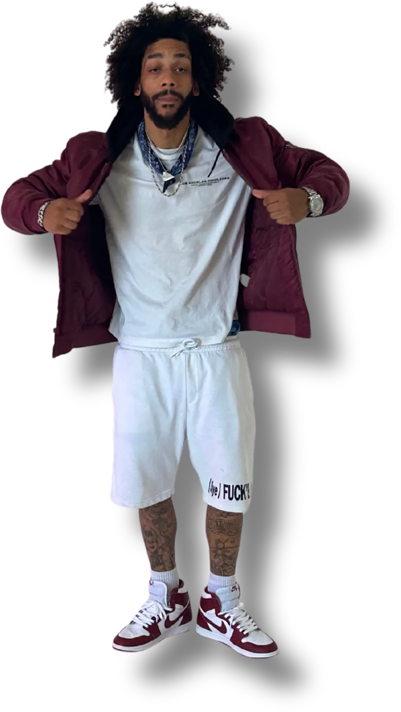 Prezident Cutt standing, holding open a maroon bomber jacket